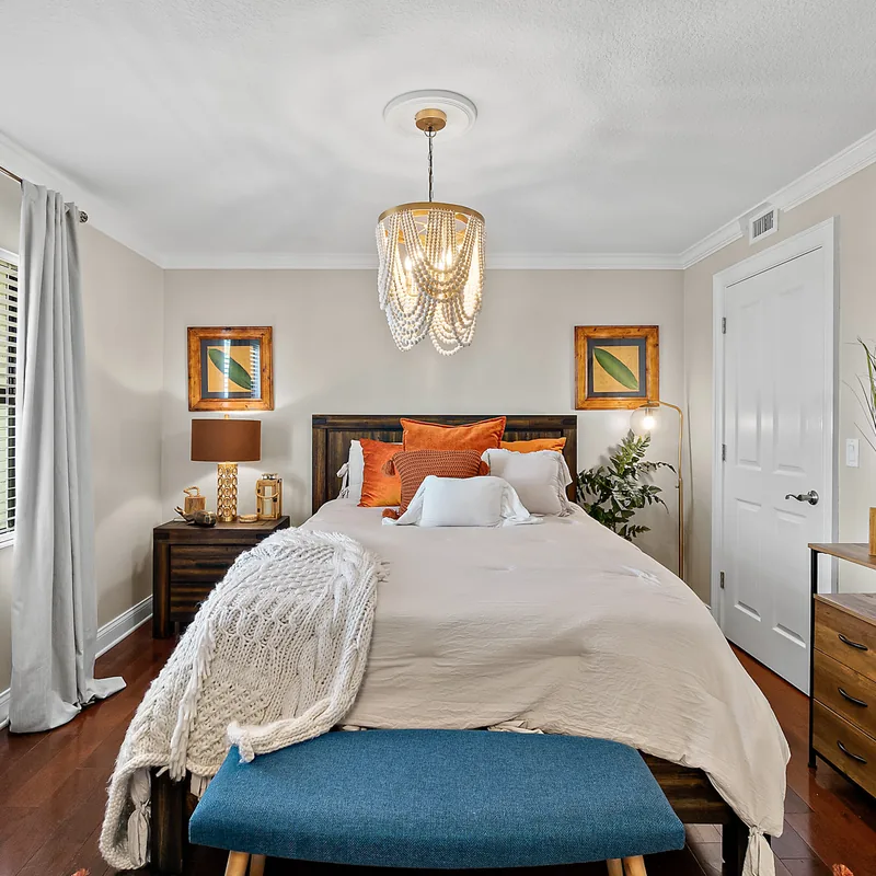 Guest bedroom with coastal furnishings in the Ormond Beach oceanfront penthouse