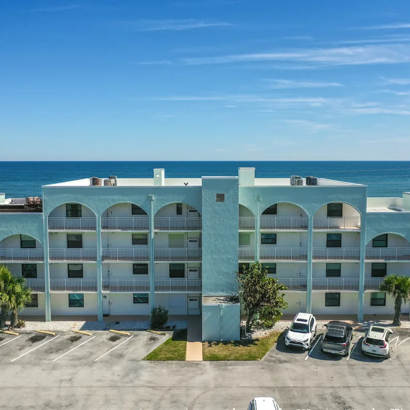 Aerial view of the Ocean Aire condominium building and its oceanfront position on the Ormond-by-the-Sea barrier island